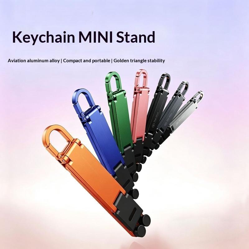 Desk Setup Stand - ขาตั้งโทรศัพท์แบบพับได้ขนาดเล็กพร้อมพวงกุญแจ ปรับมุมได้หลายระดับ ใช้งานแบบแฮนด์ฟรี เหมาะสำหรับโต๊ะทำงานและการเดินทาง อุปกรณ์รองรับโทรศัพท์มือถือ